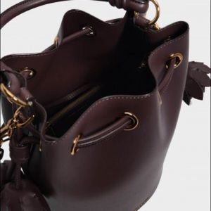 charles and keith tassel backpack